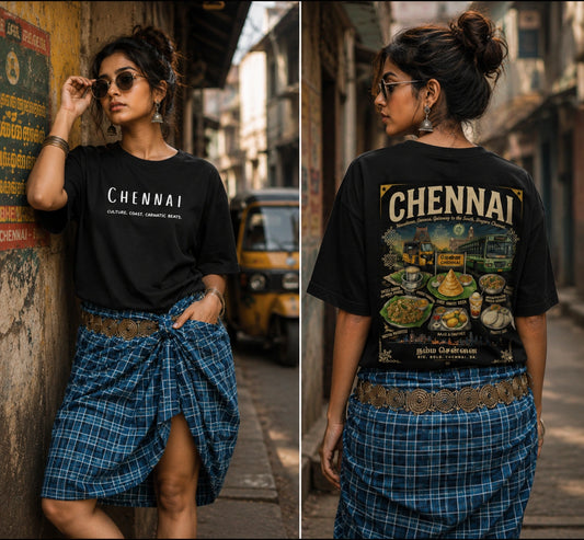 Woman wearing a black t-shirt with 'Chennai' printed on it, standing in an urban setting.