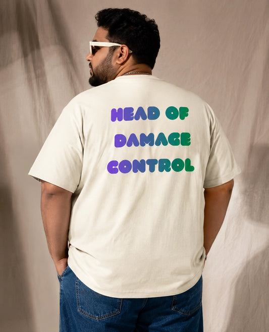 Person wearing a white t-shirt with colorful text on the back against a plain background