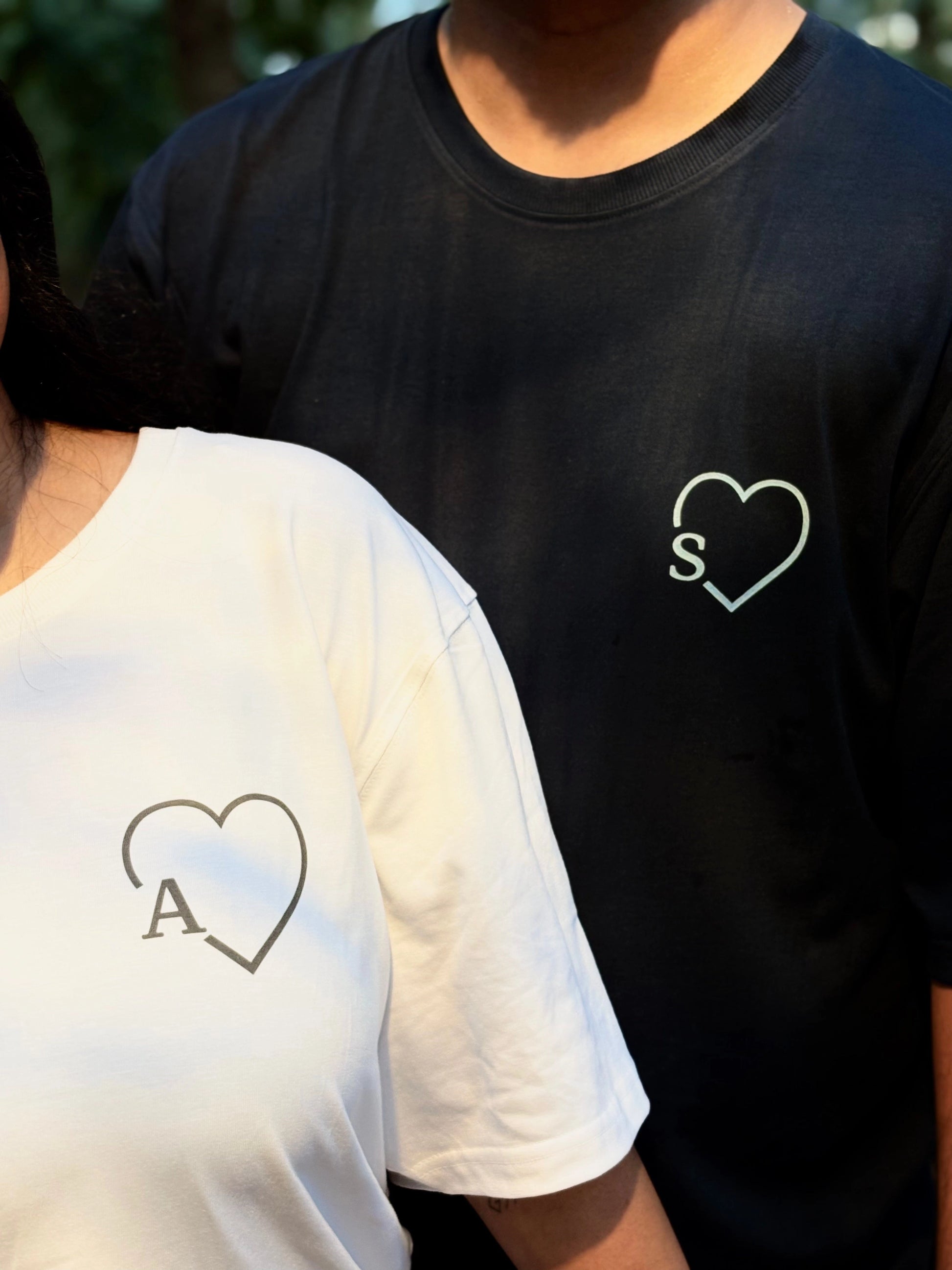 Pair of oversized unisex couple tees from The Unserious Studio with "If Lost return to Babe" and "I am Babe" designs, front view.