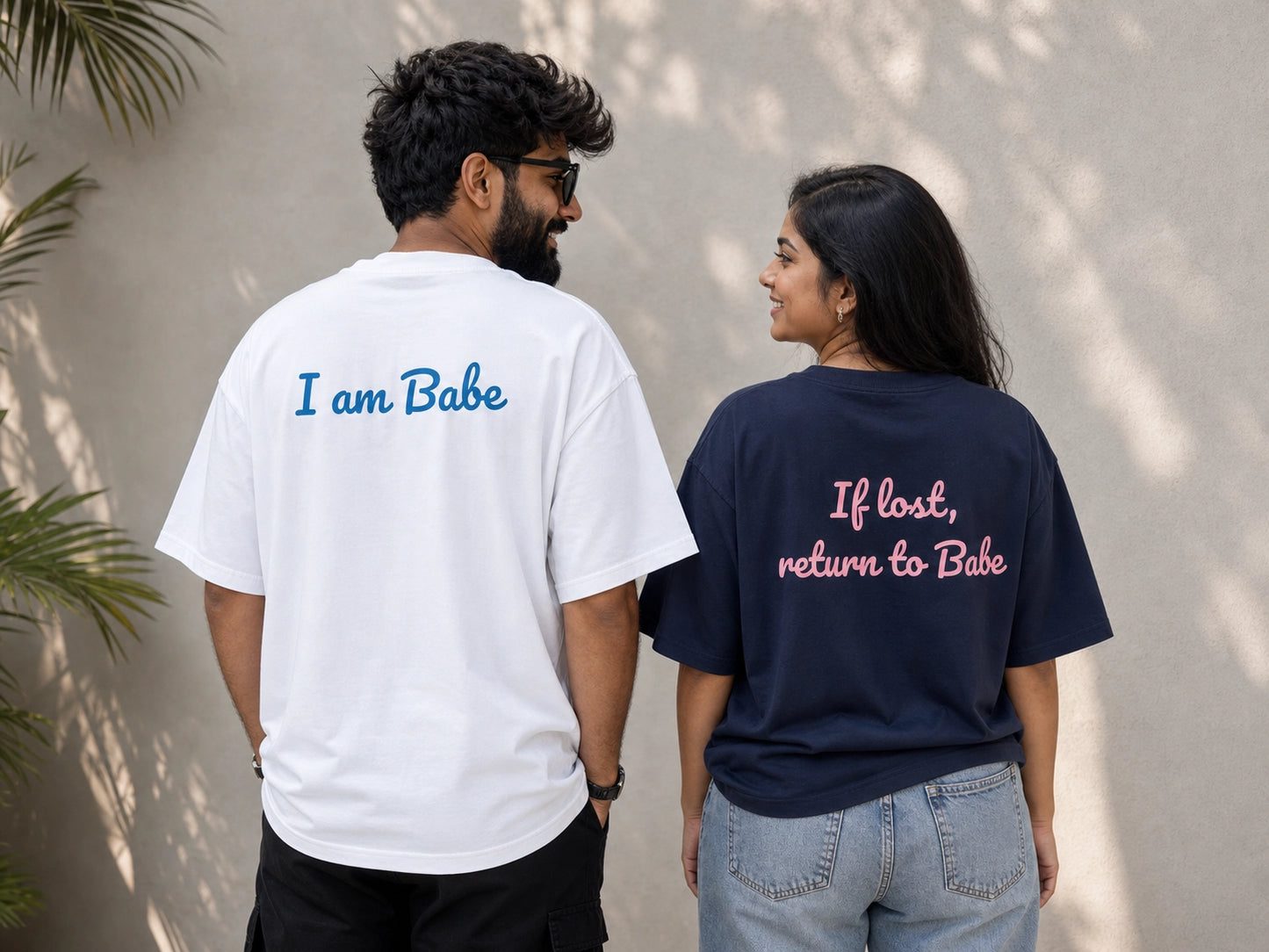 Two oversized unisex couple T-shirts from The Unserious Studio, featuring "If Lost return To Babe" and "I am Babe" designs.