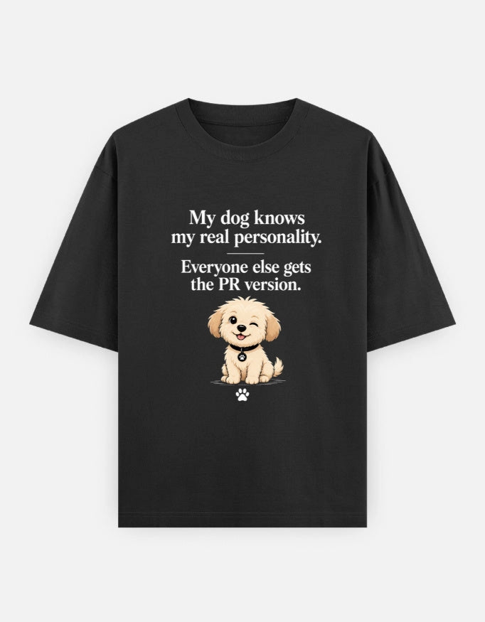 Unisex oversized T-shirt by The Unserious Studio featuring a front graphic with the phrase "My Dog Knows My Real Personality"