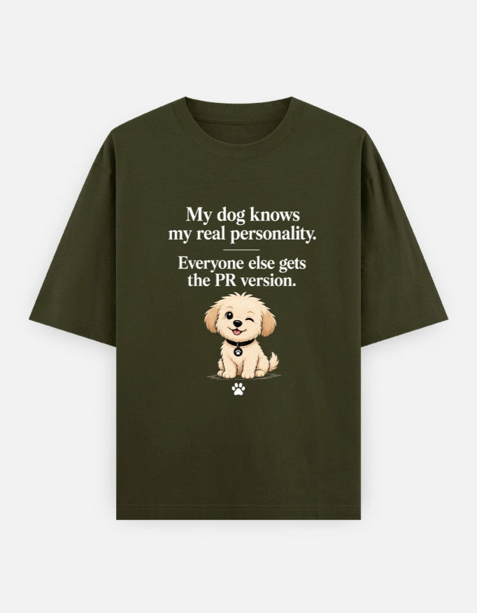 Unisex oversized T-shirt by The Unserious Studio featuring a front graphic with the phrase "My Dog Knows My Real Personality."