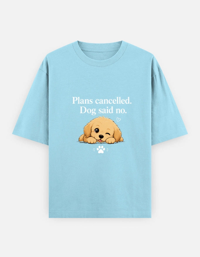 Blue unisex oversized tee by The Unserious Studio featuring a dog graphic with "Plans Cancelled" text and humorous dog illustration.