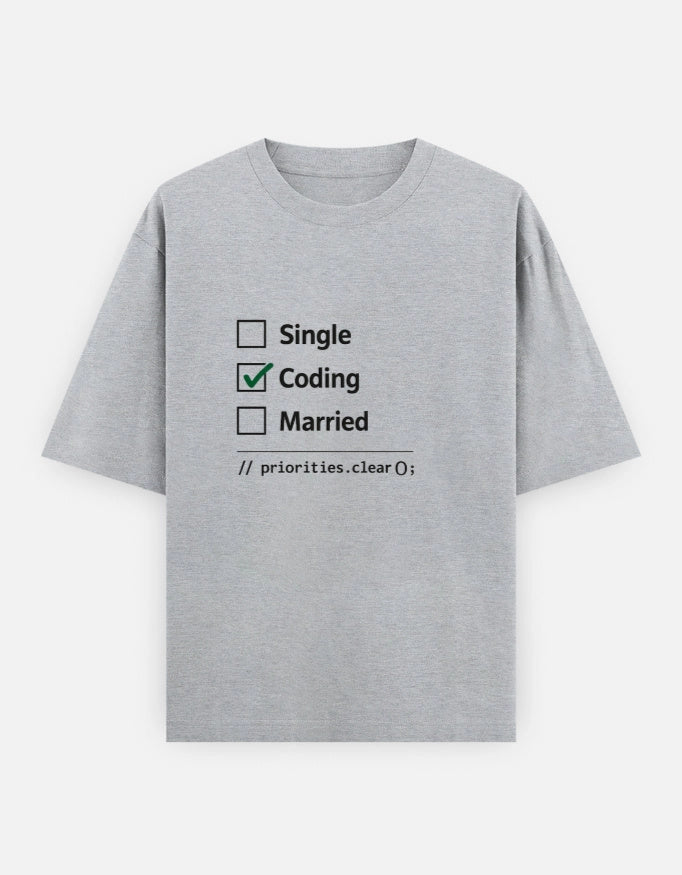 Unisex oversized T-shirt from The Unserious Studio featuring "Coding > Everything" printed front design.