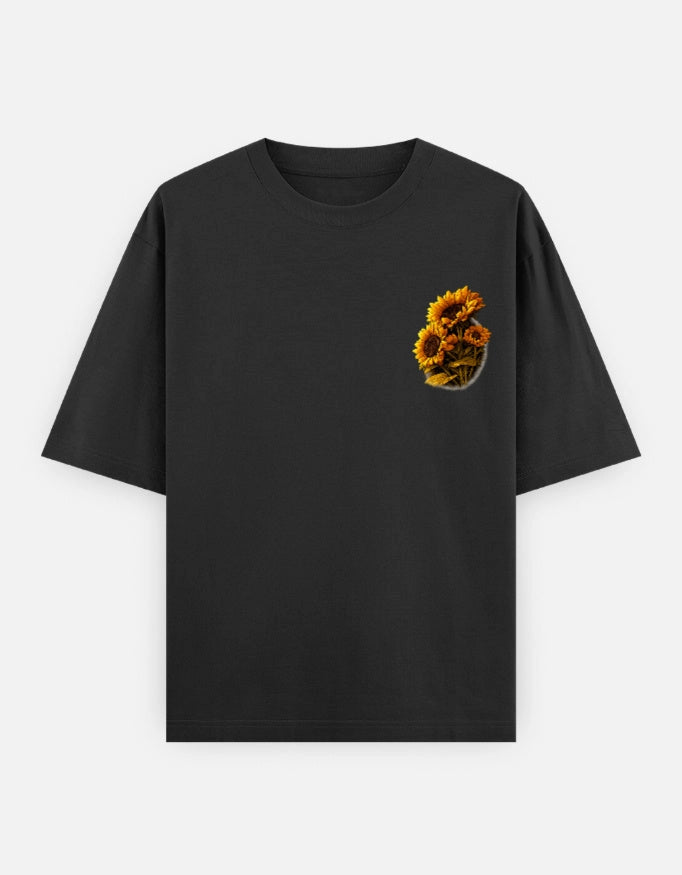 Front view of The Unserious Oversized Unisex Tee Sunflower Edition by The Unserious Studio featuring a sunflower graphic on a relaxed fit shirt.