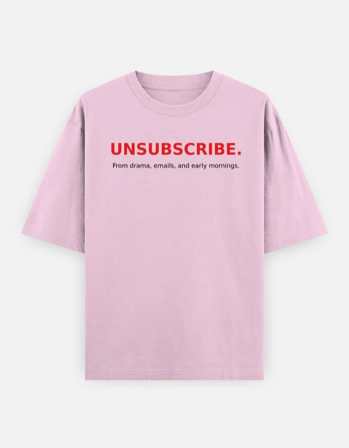 Unisex oversized tee from The Unserious Studio with "Unsubscribe from Office Drama" slogan, front view showing relaxed fit and bold print.